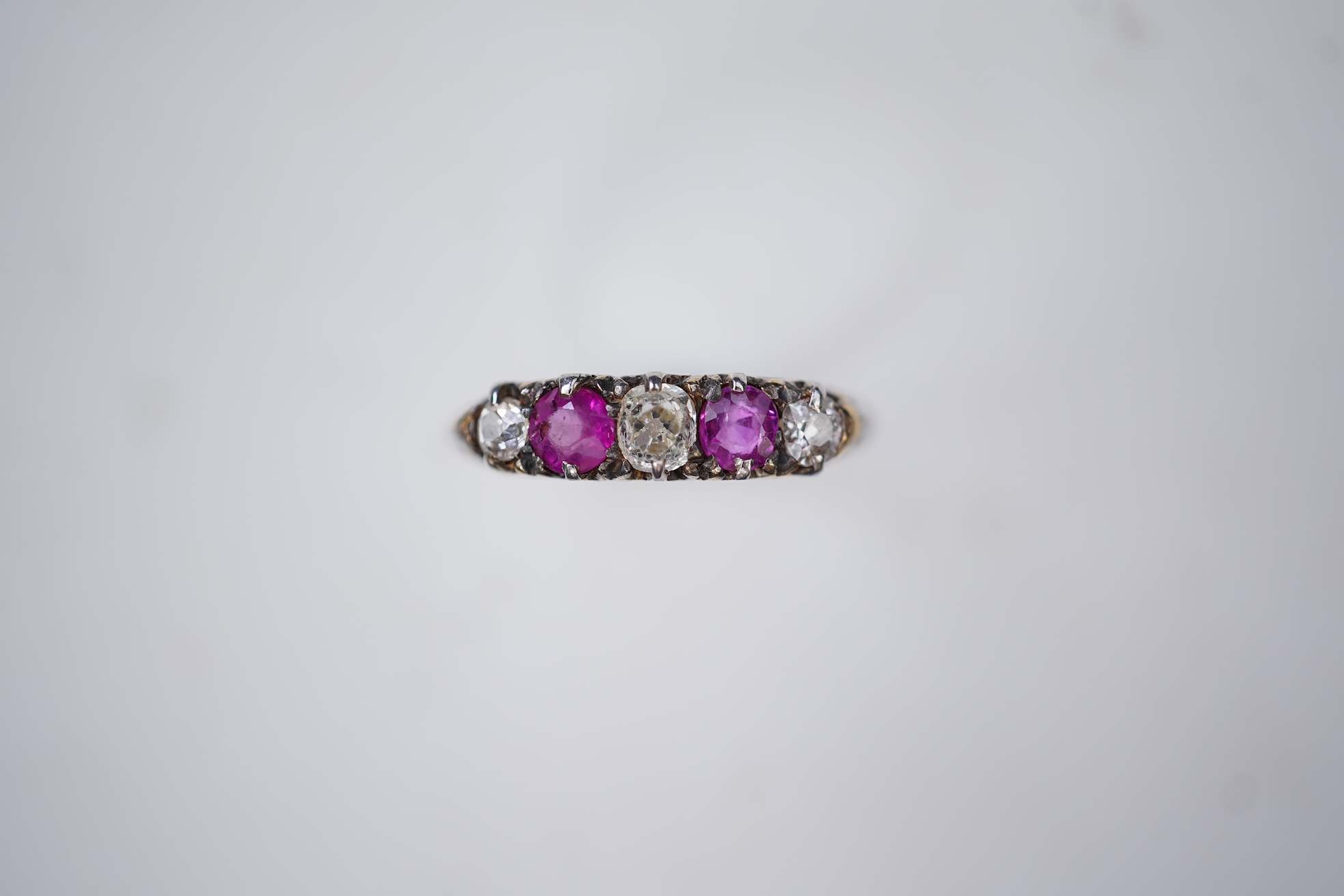 A pink sapphire and diamond ring, early 20th century